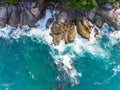 Waves crashing on seashore rocks,Top view sea surface waves background Royalty Free Stock Photo