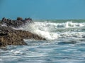 Waves crashing a shore PihaBeach, Auckland, New Zealand