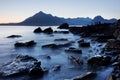 Waves crashing on shoreline with moody dramatic sky at Elgol on the Isle of Skye, Scotland, UK. The famous rocky bay. Royalty Free Stock Photo