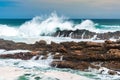 Waves crashing wildly on the rocky shore at Storms River Mouth, South Africa Royalty Free Stock Photo