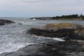 Waves crushing on the rocks at the beach on the sea coast at Jomfruland Island in Norway, Skagerrak