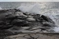 Waves crushing on the rocks at the beach on the sea coast at Jomfruland Island in Norway, Skagerrak