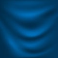Waves on a dark blue fabric material.