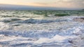 Waves at Dead Sea in winter evening Royalty Free Stock Photo