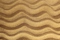 Waves are drawn on the sand. Abstract texture. Sea and vacation theme. Royalty Free Stock Photo
