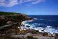 Waves eroding the cliffs of the New South Wales coast in Australia Royalty Free Stock Photo