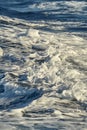 Waves with foam splasing in sea water Royalty Free Stock Photo