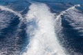The waves from a high-speed boat and island background,selective focus Royalty Free Stock Photo
