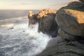 The waves hit the granite walls of Punta Moras Royalty Free Stock Photo