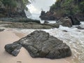 The waves hit the rocks on the beach very loudly and rumbled Royalty Free Stock Photo