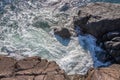 Waves hiting rocks in the Pacific Ocean