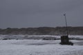 waves hitting against the beach during storm in Nr. Vorupoer on the North Sea coast in Denmark