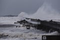 Waves hitting against the pier during the storm in Nr. Vorupoer on the North Sea coast Royalty Free Stock Photo