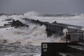 waves hitting against the pier during the storm in Nr. Vorupoer on the North Sea coast Royalty Free Stock Photo