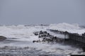 waves hitting against the pier during the storm in Nr. Vorupoer on the North Sea coast Royalty Free Stock Photo