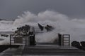 waves hitting against the pier during the storm in Nr. Vorupoer on the North Sea coast Royalty Free Stock Photo