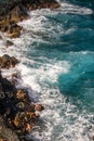 Waves hitting the rocks. Rocky cliffs on sea, seascape.