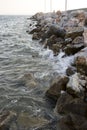 Texture of the calm water surface and wet rocks. Royalty Free Stock Photo