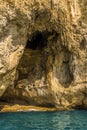 Waves lap against the base of the White Grotto on the Island of Capri, Italy Royalty Free Stock Photo