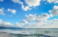 Waves in Le Bombarde beach under clouds Royalty Free Stock Photo