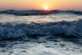 Waves of the Mediterranean Sea with sea foam and spray. Beautiful sea on sunset background. Sundown. Seascape. Royalty Free Stock Photo