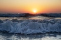 Waves of the Mediterranean Sea with sea foam and spray. Beautiful sea on sunset background. Sundown. Seascape. Running Royalty Free Stock Photo