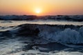 Waves of the Mediterranean Sea with sea foam and spray. Beautiful sea on sunset background. Sundown. Seascape. Royalty Free Stock Photo