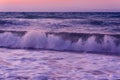 Waves and meerschaum on the sunset Royalty Free Stock Photo