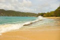 Waves meeting a pristine beach in the windward islands Royalty Free Stock Photo