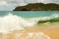 Waves meeting a pristine beach in the windward islands Royalty Free Stock Photo