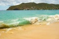 Waves meeting a pristine beach in the windward islands Royalty Free Stock Photo