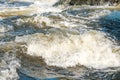 Waves on a mountain river with foam and spray rapids Royalty Free Stock Photo