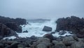 Waves of the northern sea are disintegrating on the rocks