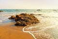 Waves in the ocean and rocks in the water.