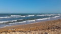 Waves in the ocean and sand beach