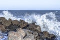 Waves over breakwater on the sea shore Royalty Free Stock Photo