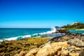 Waves of the Pacific Ocean crashing onto the rocky shoreline of the west coast of the island of Oahu Royalty Free Stock Photo