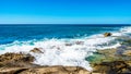 Waves of the Pacific Ocean crashing on the rocks on the shoreline of Ko Olina on the island of Oahu Royalty Free Stock Photo