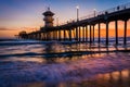 Waves in the Pacific Ocean and the pier at sunset Royalty Free Stock Photo