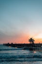 Waves in the Pacific Ocean and the pier at sunset in San Clemente, Orange County, California Royalty Free Stock Photo