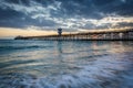 Waves in the Pacific Ocean and the pier at sunset, in Seal Beach