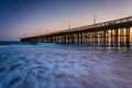 Waves in the Pacific Ocean and the pier at sunset, in Ventura, C Royalty Free Stock Photo