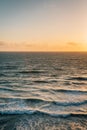 Waves in the Pacific Ocean at sunset, in Encinitas, San Diego County, California Royalty Free Stock Photo