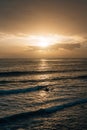 Waves in the Pacific Ocean at sunset, at Pearl Street Beach in Laguna Beach, Orange County, California