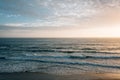 Waves in the Pacific Ocean at sunset, at Pearl Street Beach in Laguna Beach, Orange County, California