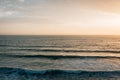 Waves in the Pacific Ocean at sunset, at Pearl Street Beach in Laguna Beach, Orange County, California