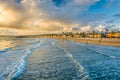 Waves in the Pacific Ocean and view of the beach at sunset Royalty Free Stock Photo