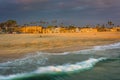 Waves in the Pacific Ocean and view of the beach at sunset Royalty Free Stock Photo