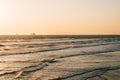 Waves in the Paciifc Ocean at sunset, in Huntington Beach, Orange County, California