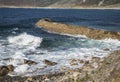 Waves and pier at Sennen Cove in Cornwall. Royalty Free Stock Photo